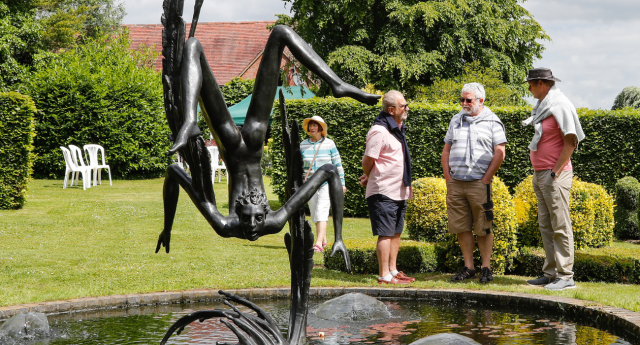 A group of attendees enjoying the Gardens of Heroes and Villains