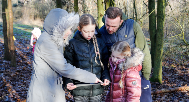 A group of Mini Foresters and parents exploring the Forest at Middle Spernal