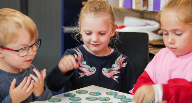 A group of children being creative inside the barn at Middle Spernal