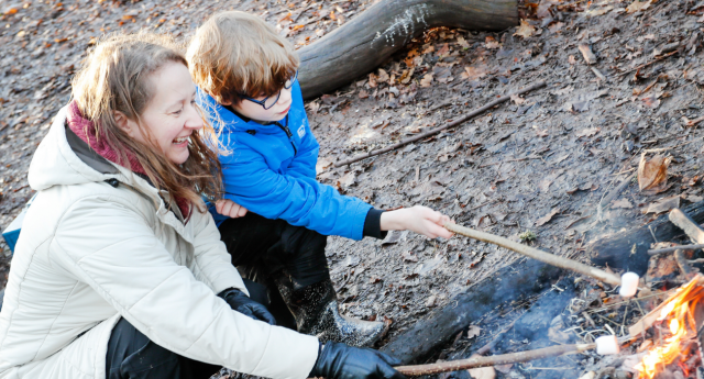 A Mini Forester and parent toasting marshmallows at Gorcott Hill