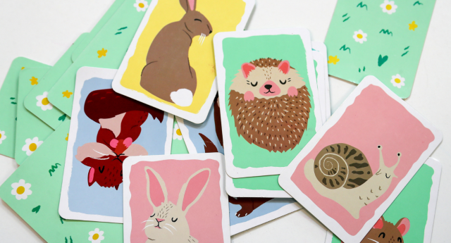 A collection of animal cards lay across a craft table at Gorcott Hill