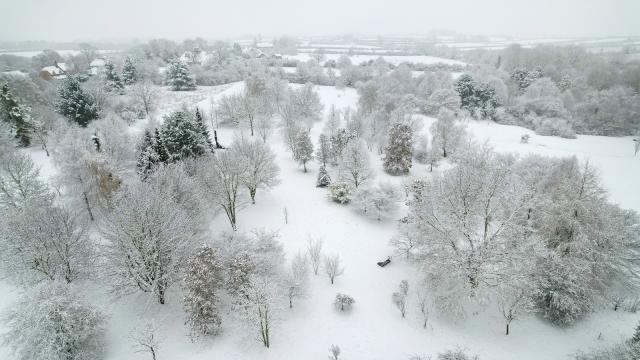 An aerial view of the Arboretum, dusted in fresh snow. 