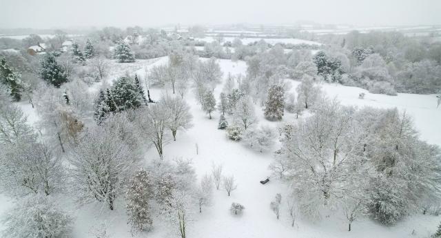 An aerial view of the Arboretum, dusted in fresh snow. 