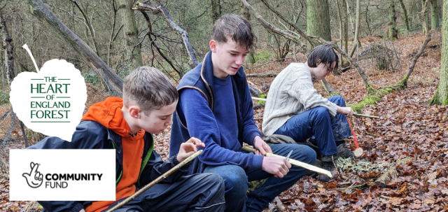 Young people taking part in a bushcraft activity in the Heart of England Forest.